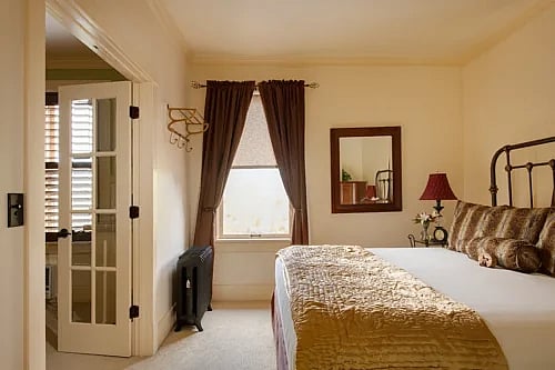 A view of the bedroom portion of the King Suite at the best small hotel in Cody, Wyoming.