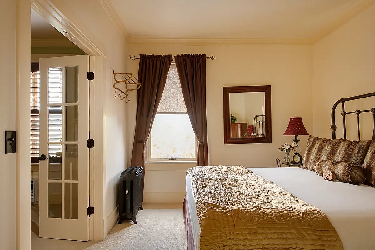 A view of the bedroom portion of the King Suite at the best small hotel in Cody, Wyoming.