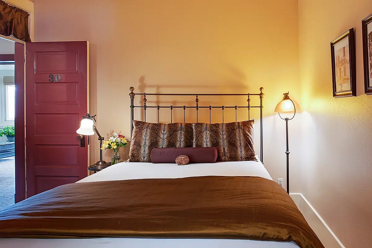 A comfortable bed awaits guests visiting Cody, Wyoming at the historic Chamberlin Inn.