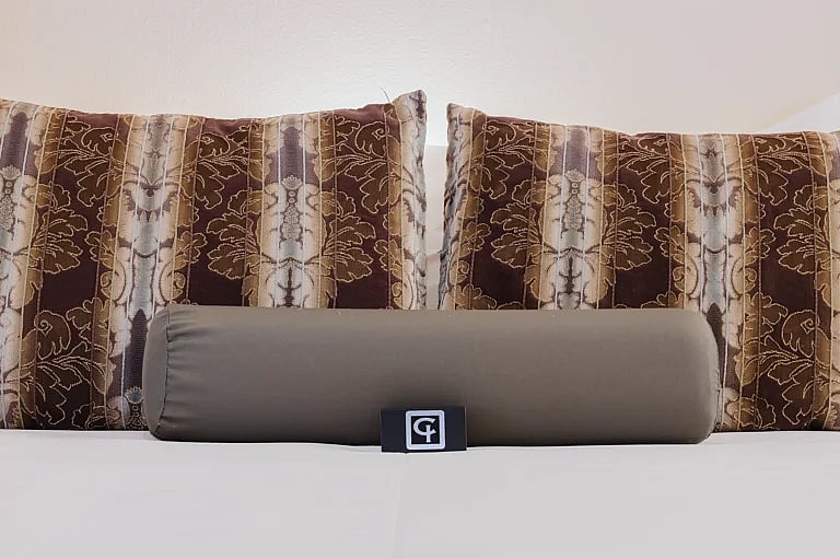 Close-up of cozy pillows on the comfortable bed in the luxurious Garden Loft apartment at the Chamberlin Inn in Cody, Wyoming. This boutique hotel is the best place to stay outside the East Entrance to Yellowstone.