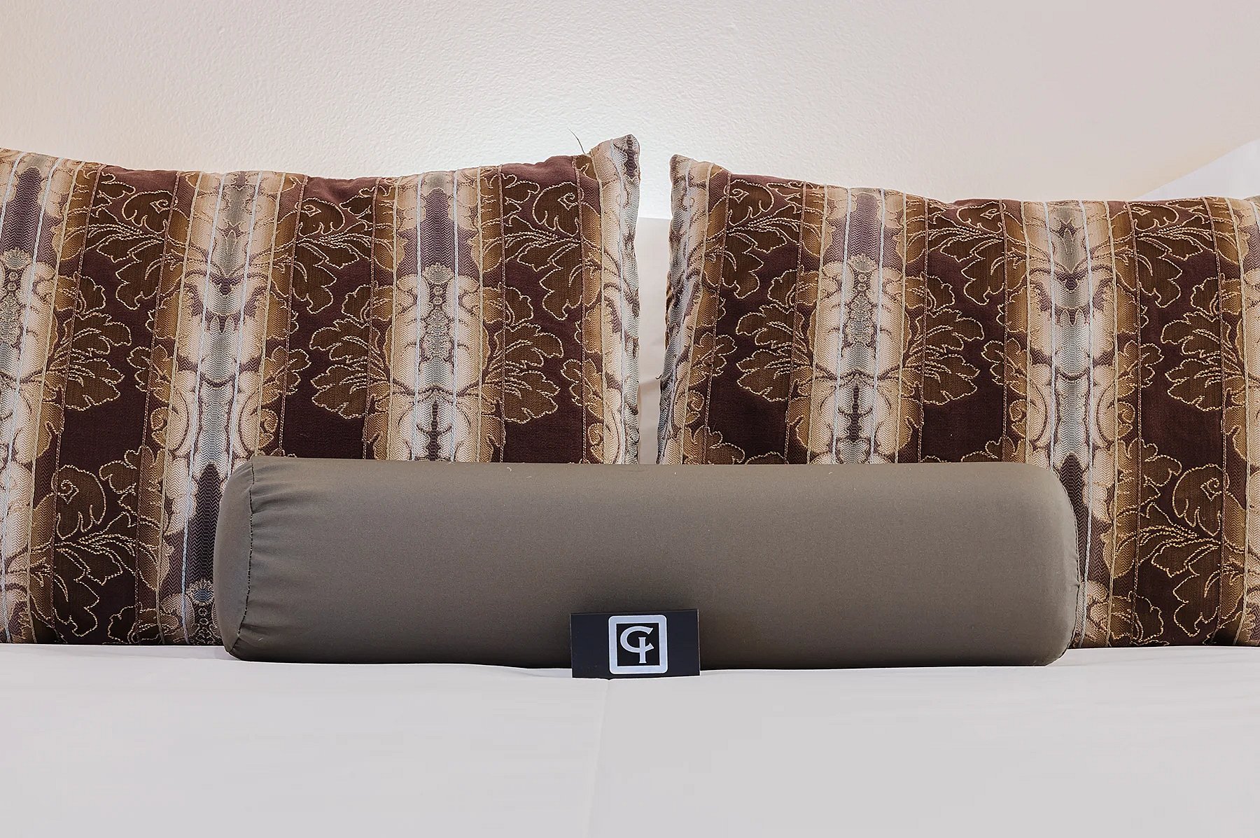 Close-up of cozy pillows on the comfortable bed in the luxurious Garden Loft apartment at the Chamberlin Inn in Cody, Wyoming. This boutique hotel is the best place to stay outside the East Entrance to Yellowstone. thumbnail