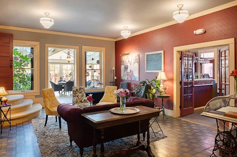The Chamberlin Inn, a historic boutique hotel in Cody Wyoming has a bar, cocktail lounge and glass conservatory with an open plan that makes it a favorite of locals and visitors alike.
