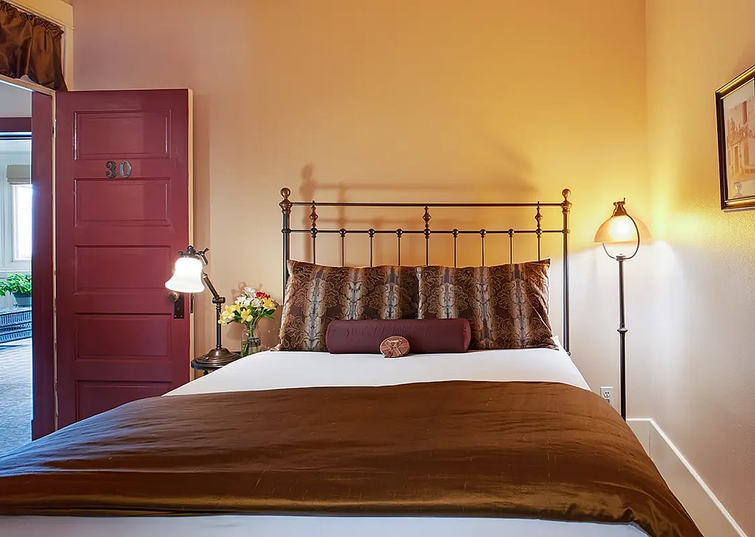 A comfortable bed awaits guests visiting Cody, Wyoming at the historic Chamberlin Inn.