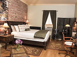 The historic Hemingway Room at the boutique hotel, the Chamberlin Inn, is furnished to reflect Earnest Hemingway's style.