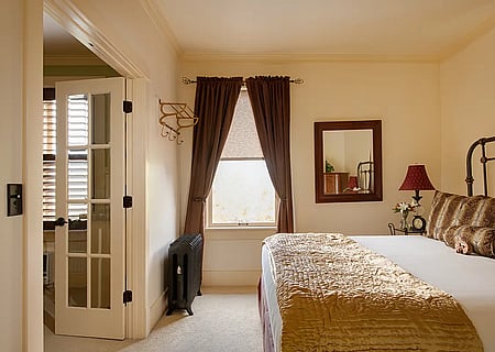 A view of the bedroom portion of the King Suite at the best small hotel in Cody, Wyoming.
