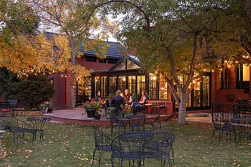 Guests relaxing by the fire in Cody, WY luxury hotel