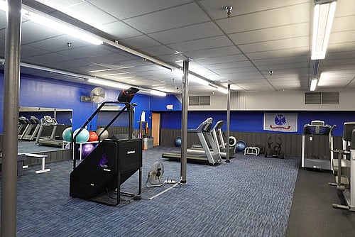 Elliptical and stretching area at fitness center