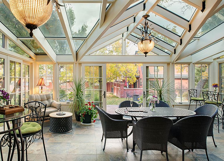The Chamberlin Inn's inviting conservatory has comfortable seating or can be transformed into a meeting venue in Cody, Wyoming.