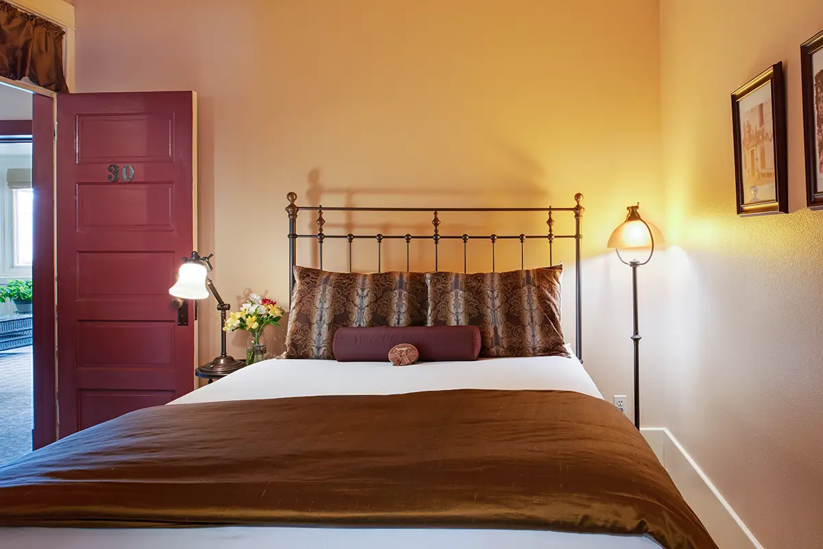 A comfortable bed awaits guests visiting Cody, Wyoming at the historic Chamberlin Inn.