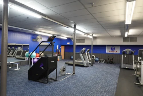 Elliptical and stretching area at fitness center